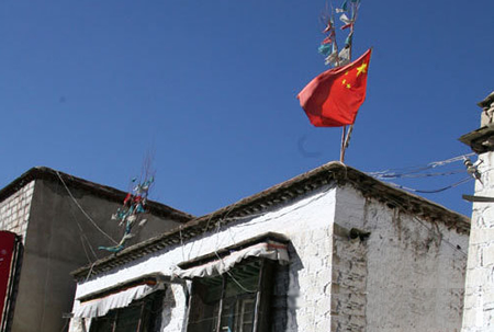 Tibetans Forced To Fly The Flag Of Their Oppressor!