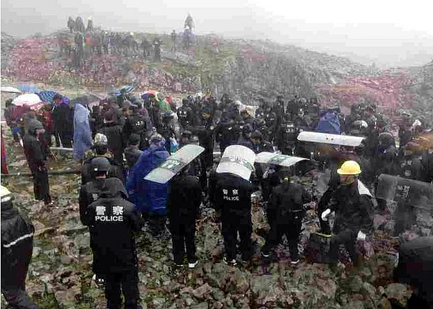 China's paramilitary beat and arrested Tibetan women who opposed mining of a local mountain.